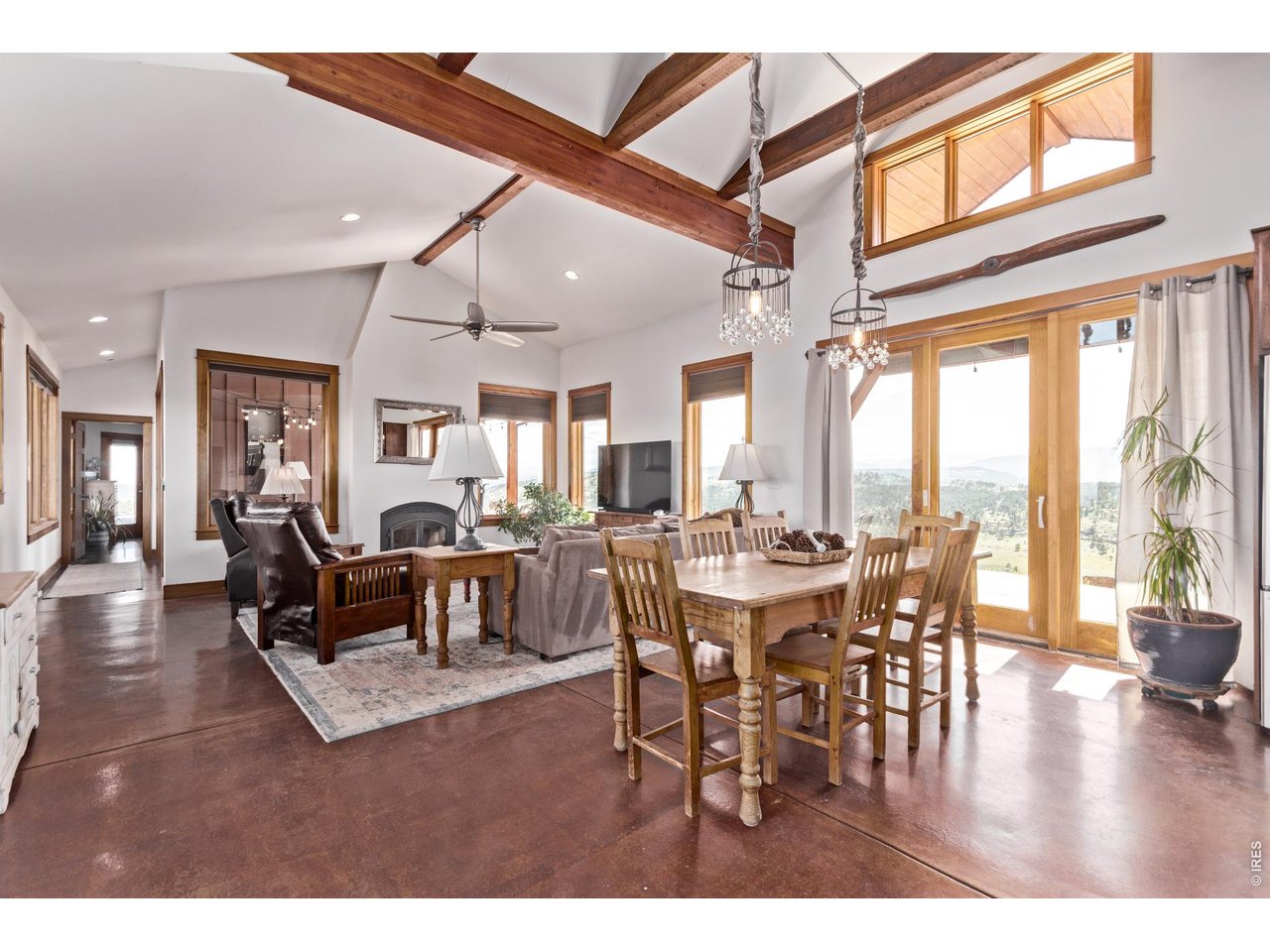 399 Northview Road Berthoud, CO 80513 - Photo 9 of 39 a view of a dining room with furniture window and wooden floor