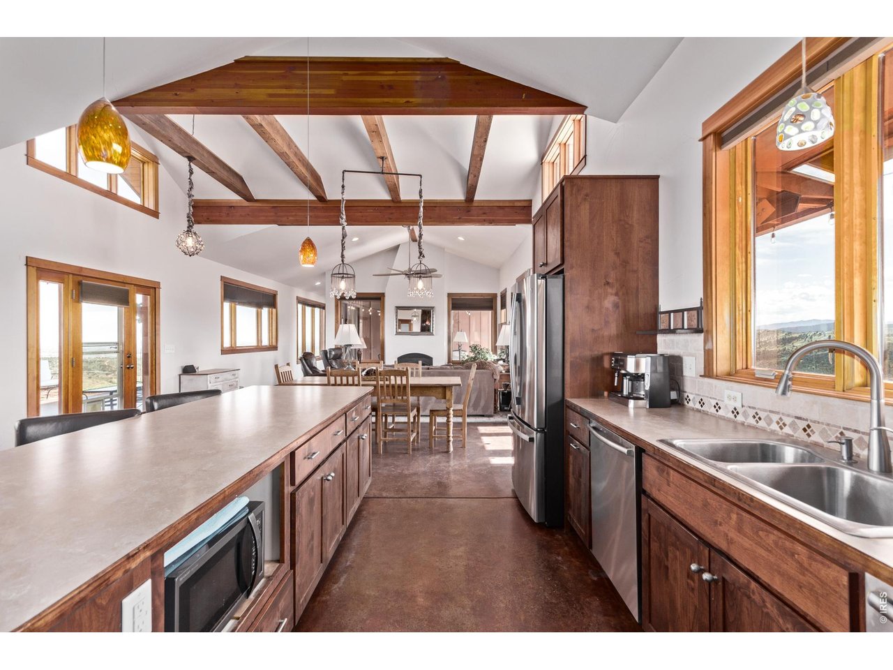 399 Northview Road Berthoud, CO 80513 - Photo 10 of 39 a kitchen with stainless steel appliances granite countertop a sink a stove and a wooden floors