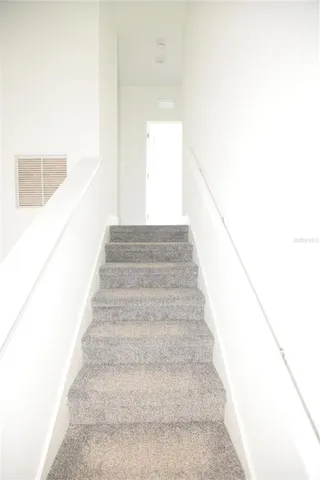 a view of staircase with white walls and white walls