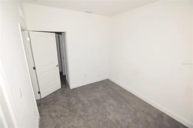 an empty room with a mirror