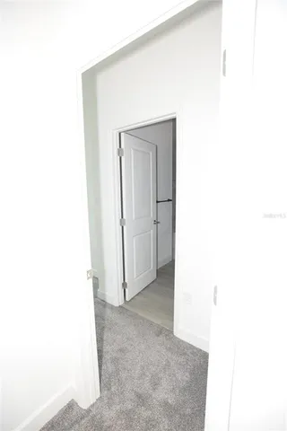 a view of a room with a white wall