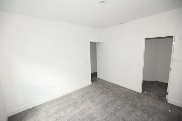 a bathroom with a granite countertop sink mirror and shower