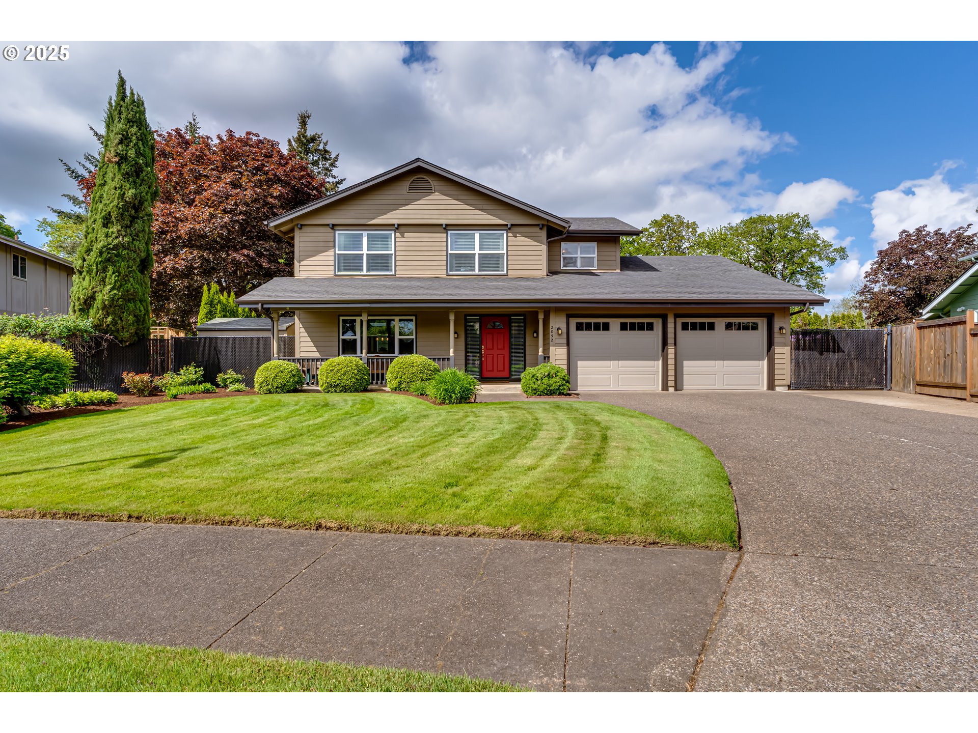2852 Metolius Drive Eugene, OR 97408 - Photo 1 of 48 a front view of a house with a yard
