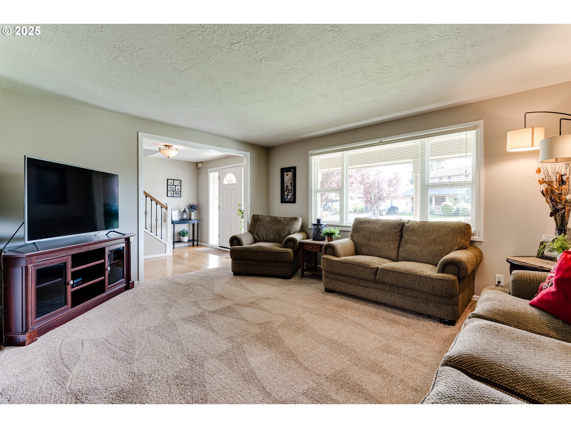 2852 Metolius Drive Eugene, OR 97408 - Photo 13 of 48 a living room with furniture and a flat screen tv