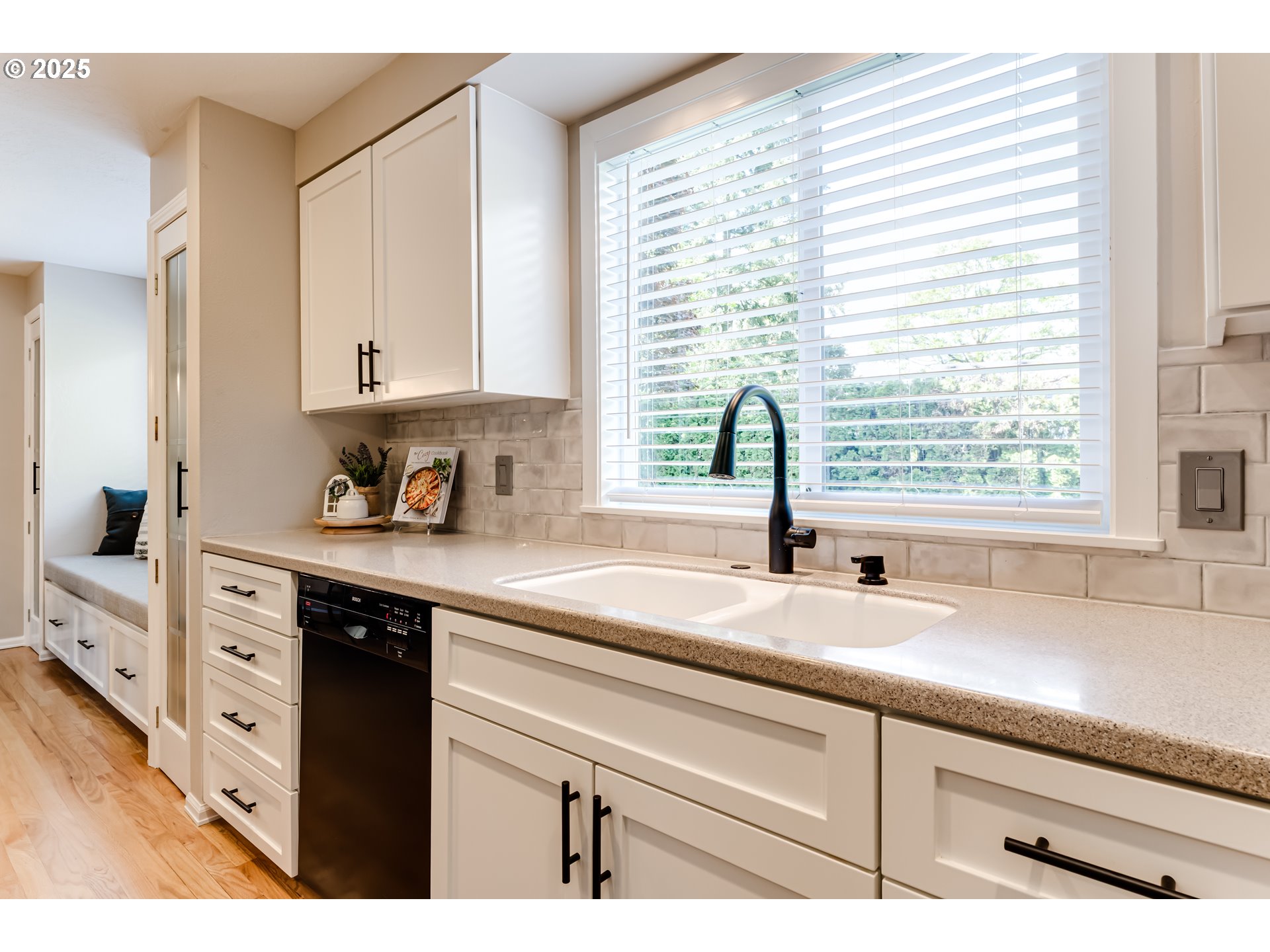 2852 Metolius Drive Eugene, OR 97408 - Photo 16 of 48 a kitchen with appliances cabinets and a large window