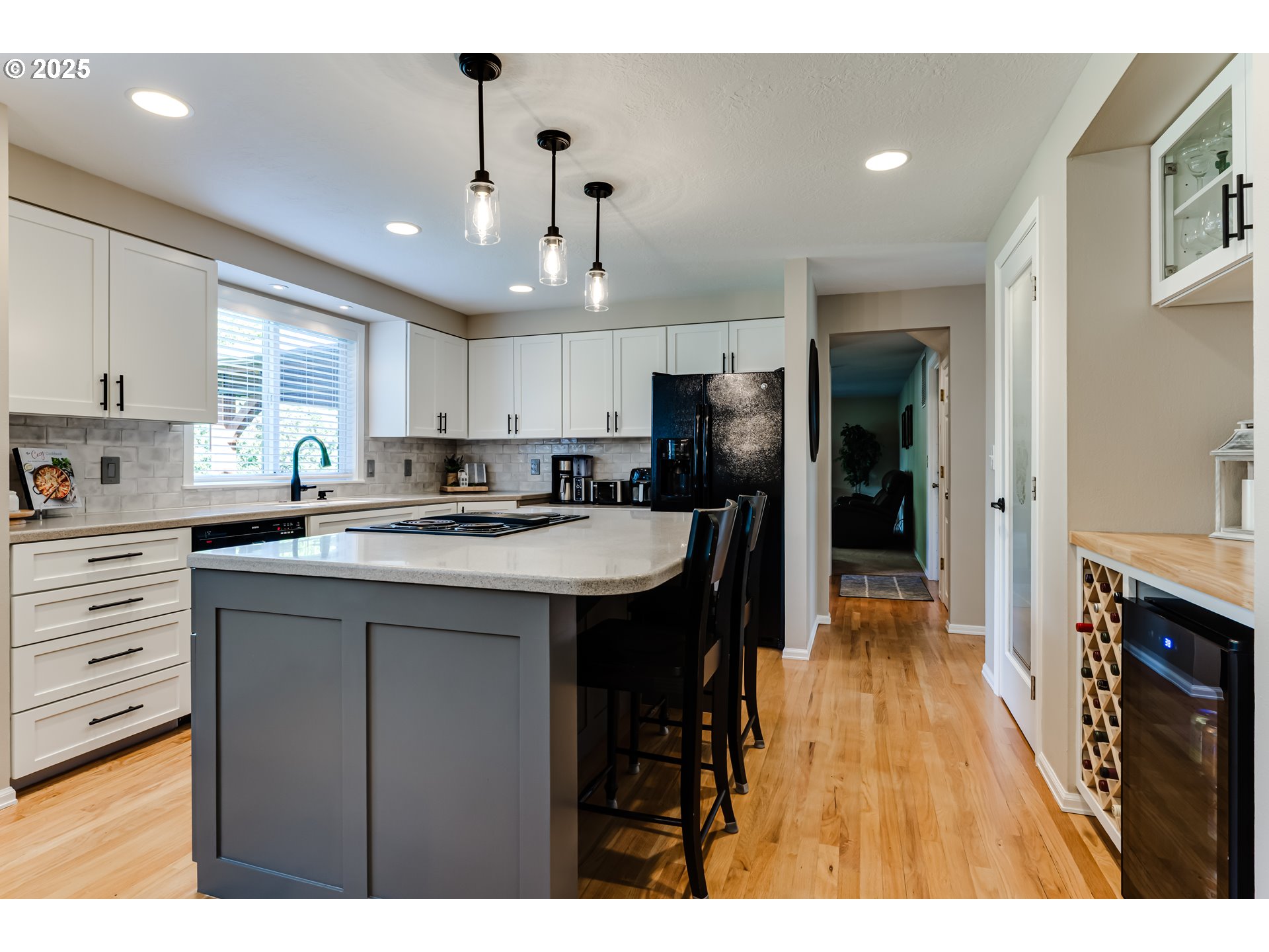 2852 Metolius Drive Eugene, OR 97408 - Photo 18 of 48 a kitchen with kitchen island granite countertop a sink cabinets and stainless steel appliances