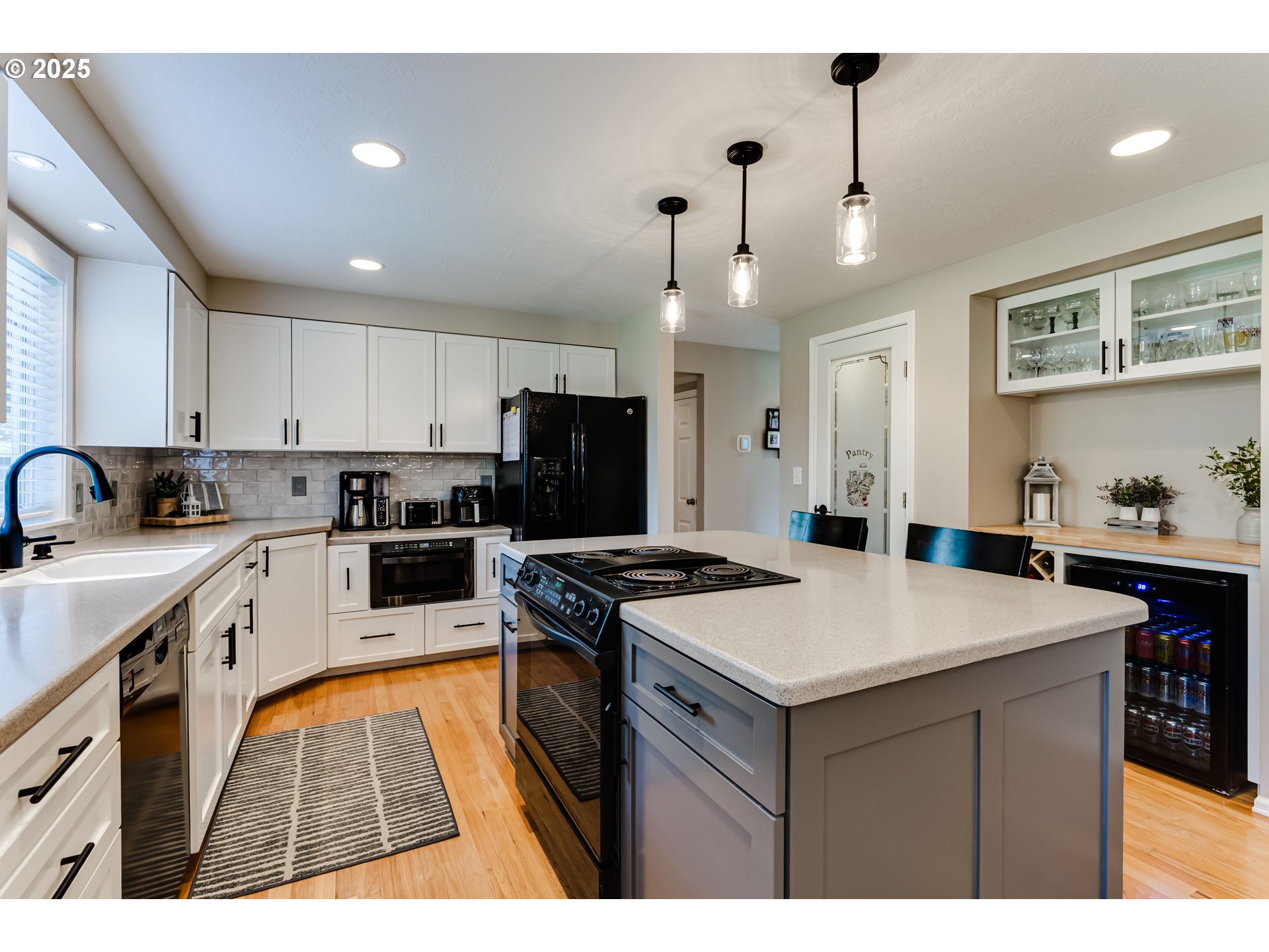 2852 Metolius Drive Eugene, OR 97408 - Photo 20 of 48 a kitchen with a sink a stove a refrigerator and a center island