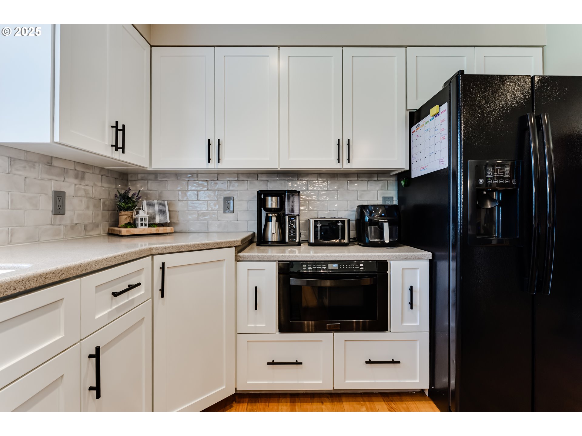 2852 Metolius Drive Eugene, OR 97408 - Photo 21 of 48 a kitchen with stainless steel appliances a refrigerator sink and cabinets