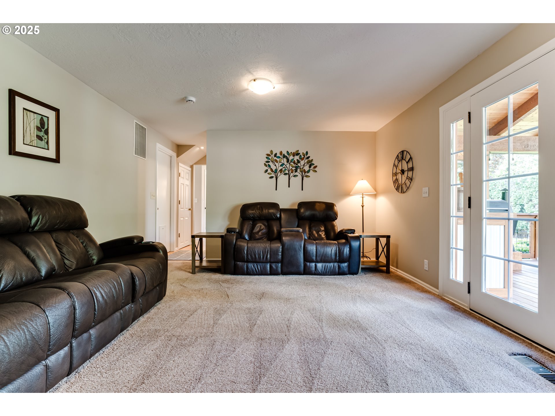 2852 Metolius Drive Eugene, OR 97408 - Photo 24 of 48 a living room with furniture a couch and a large window