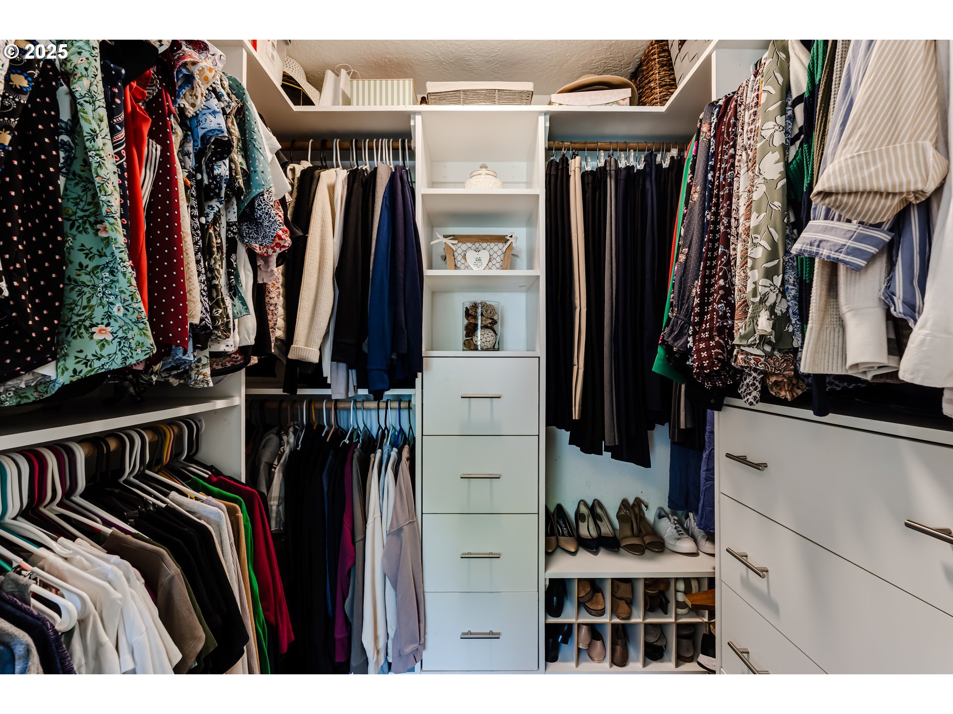 2852 Metolius Drive Eugene, OR 97408 - Photo 32 of 48 a view of walk in closet with clothes and shoes