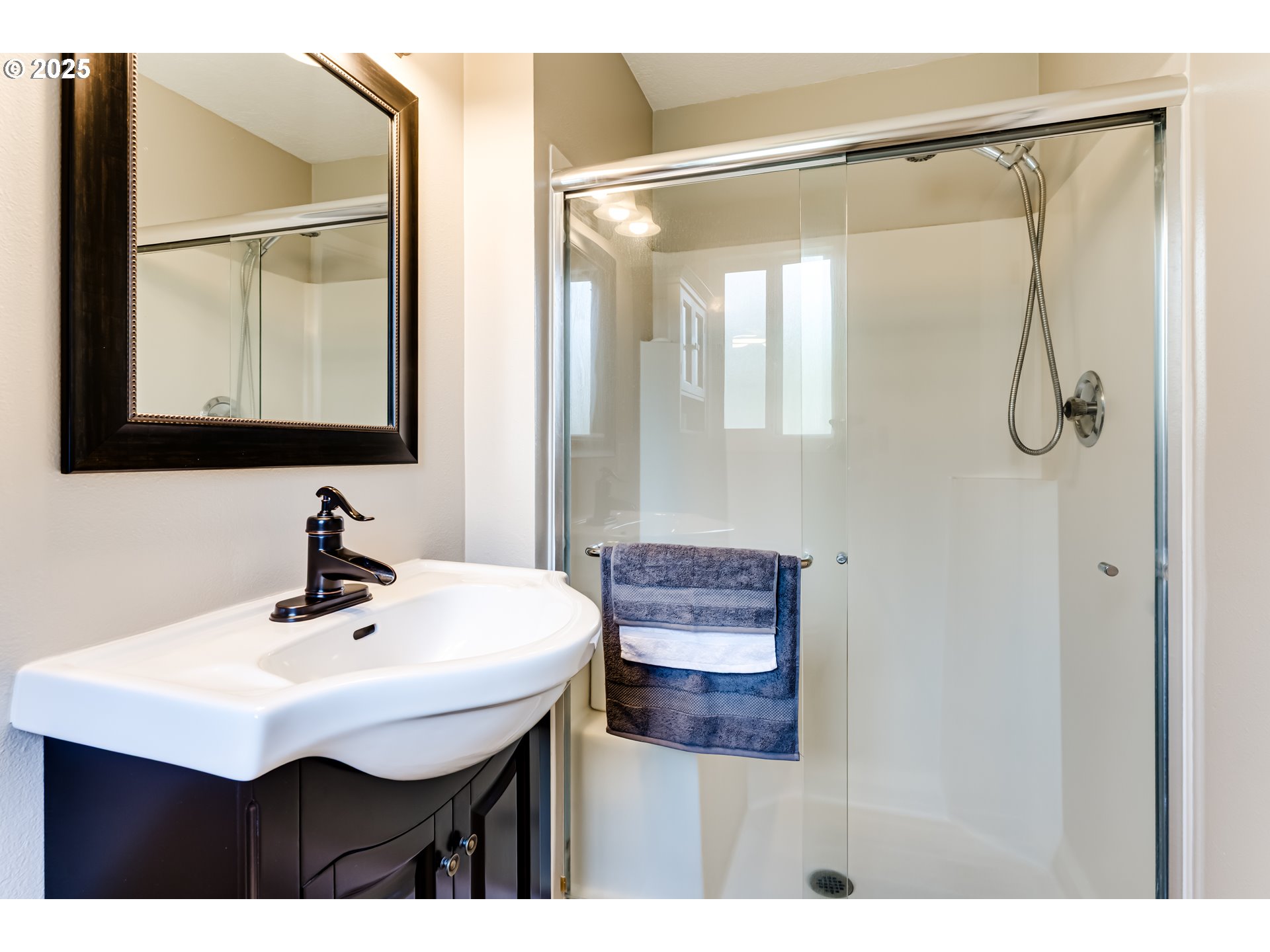 2852 Metolius Drive Eugene, OR 97408 - Photo 33 of 48 a bathroom with a sink mirror and vanity