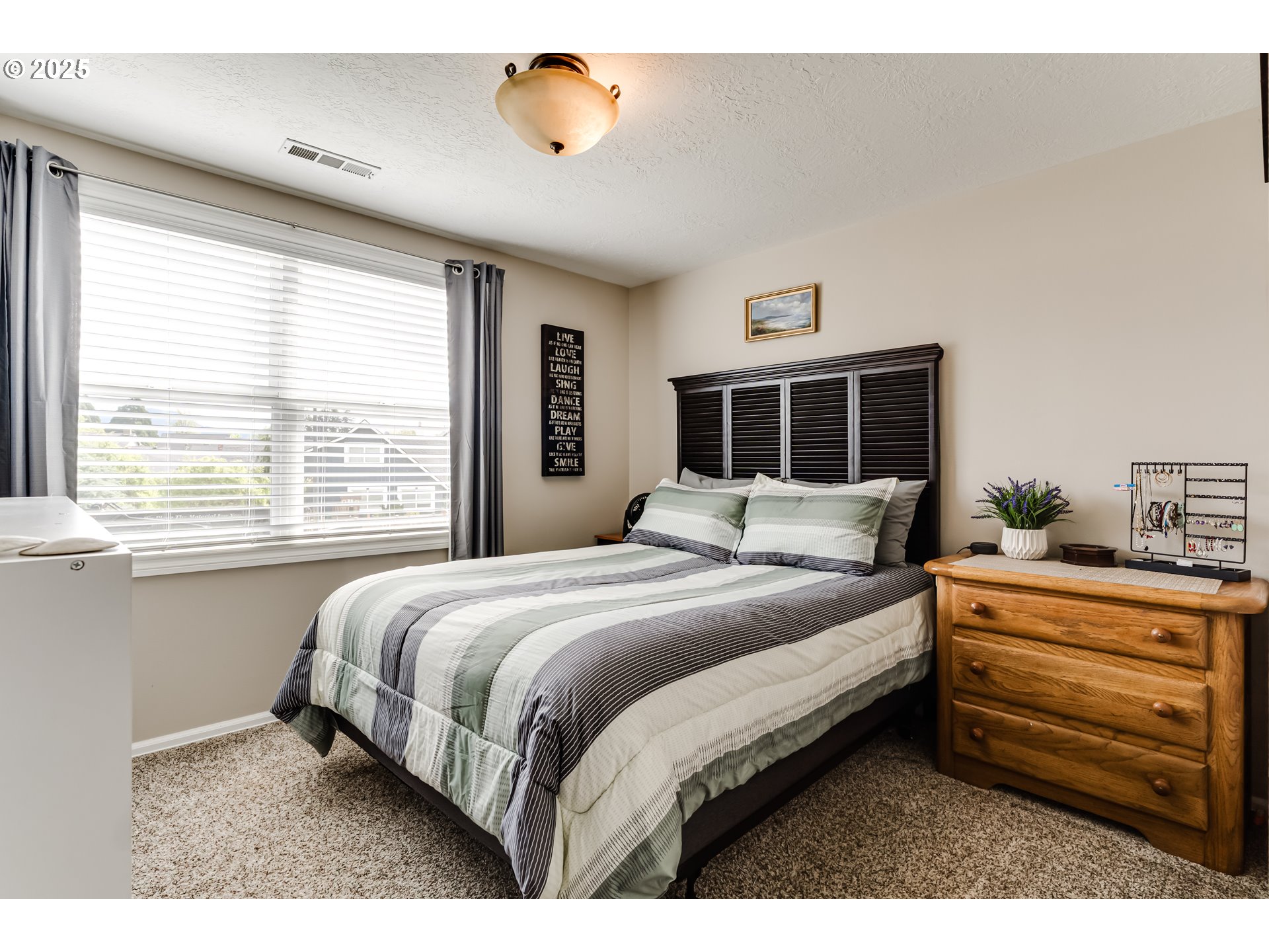 2852 Metolius Drive Eugene, OR 97408 - Photo 36 of 48 a bedroom with a bed and a window