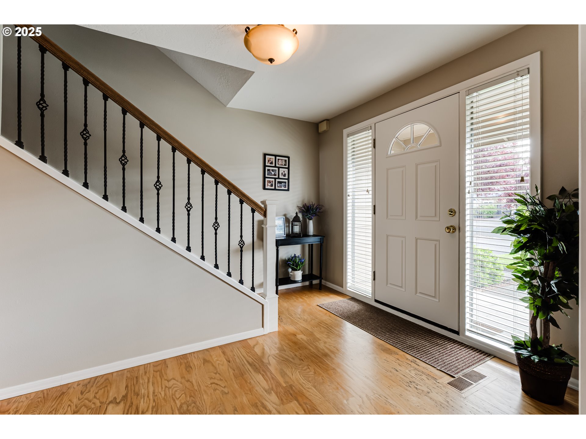 2852 Metolius Drive Eugene, OR 97408 - Photo 7 of 48 a view of an entryway with wooden floor and stairs