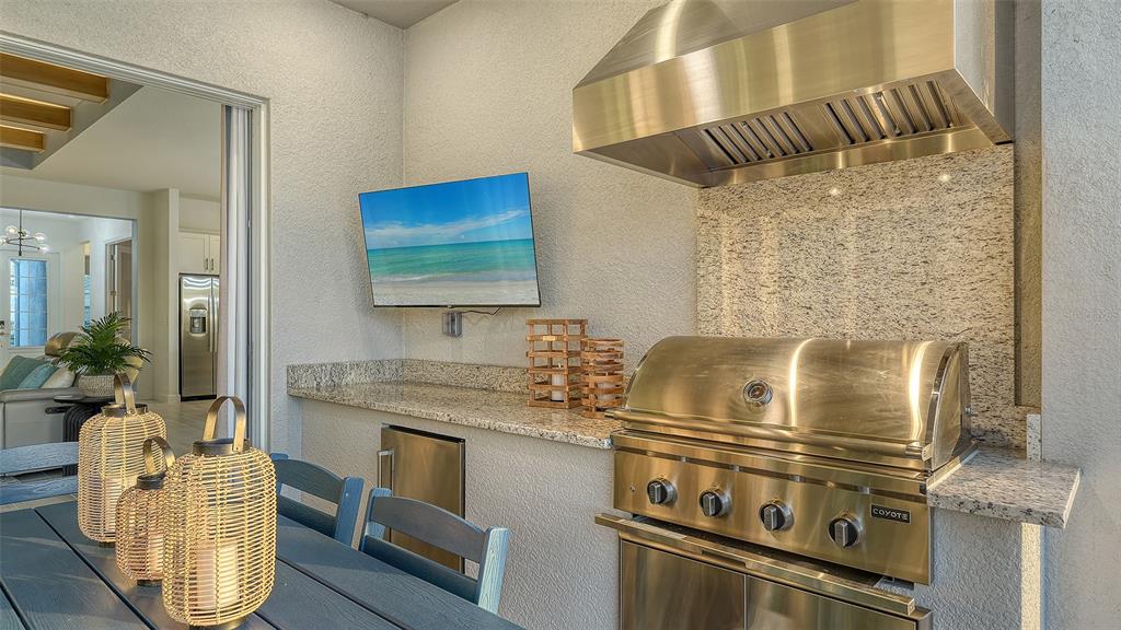 5612 Lightning Whelk Lane Lakewood Ranch, FL 34211 - Photo 15 of 44 a kitchen with a stove and a sink