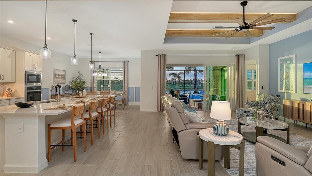 5612 Lightning Whelk Lane Lakewood Ranch, FL 34211 - Photo 22 of 44 a view of a dining room with furniture window and outside view