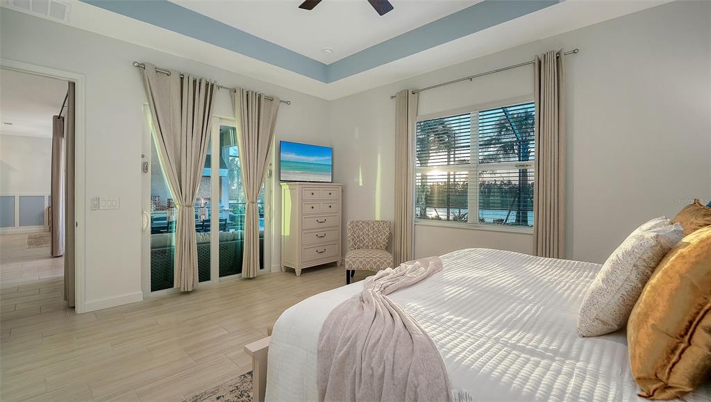 5612 Lightning Whelk Lane Lakewood Ranch, FL 34211 - Photo 26 of 44 a bedroom with a bed and a window