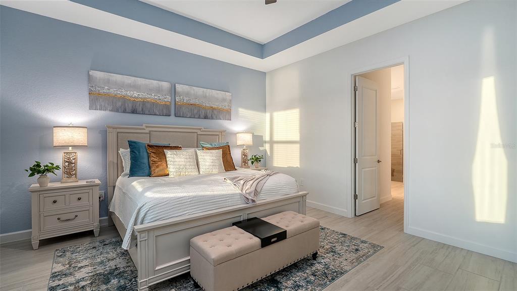 5612 Lightning Whelk Lane Lakewood Ranch, FL 34211 - Photo 27 of 44 a bedroom with a bed and a window