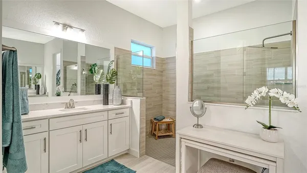 a bathroom with a sink and mirror