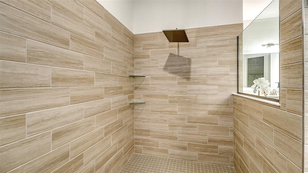 5612 Lightning Whelk Lane Lakewood Ranch, FL 34211 - Photo 31 of 44 a bathroom with a shower