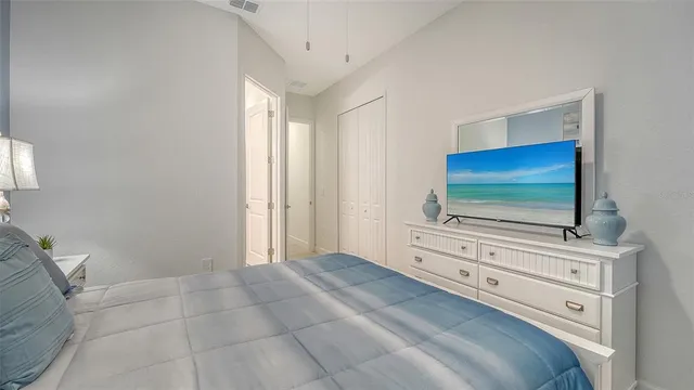 a bathroom with a granite countertop toilet sink and a mirror