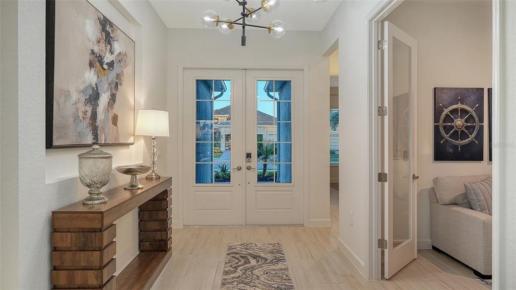 5612 Lightning Whelk Lane Lakewood Ranch, FL 34211 - Photo 6 of 44 a bathroom with a bathtub and a shower