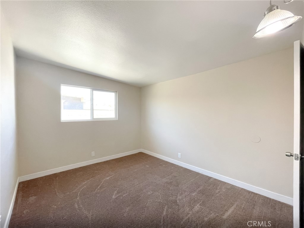 44739 3rd Street East Lancaster, CA 93535 - Photo 17 of 24 an empty room with a window