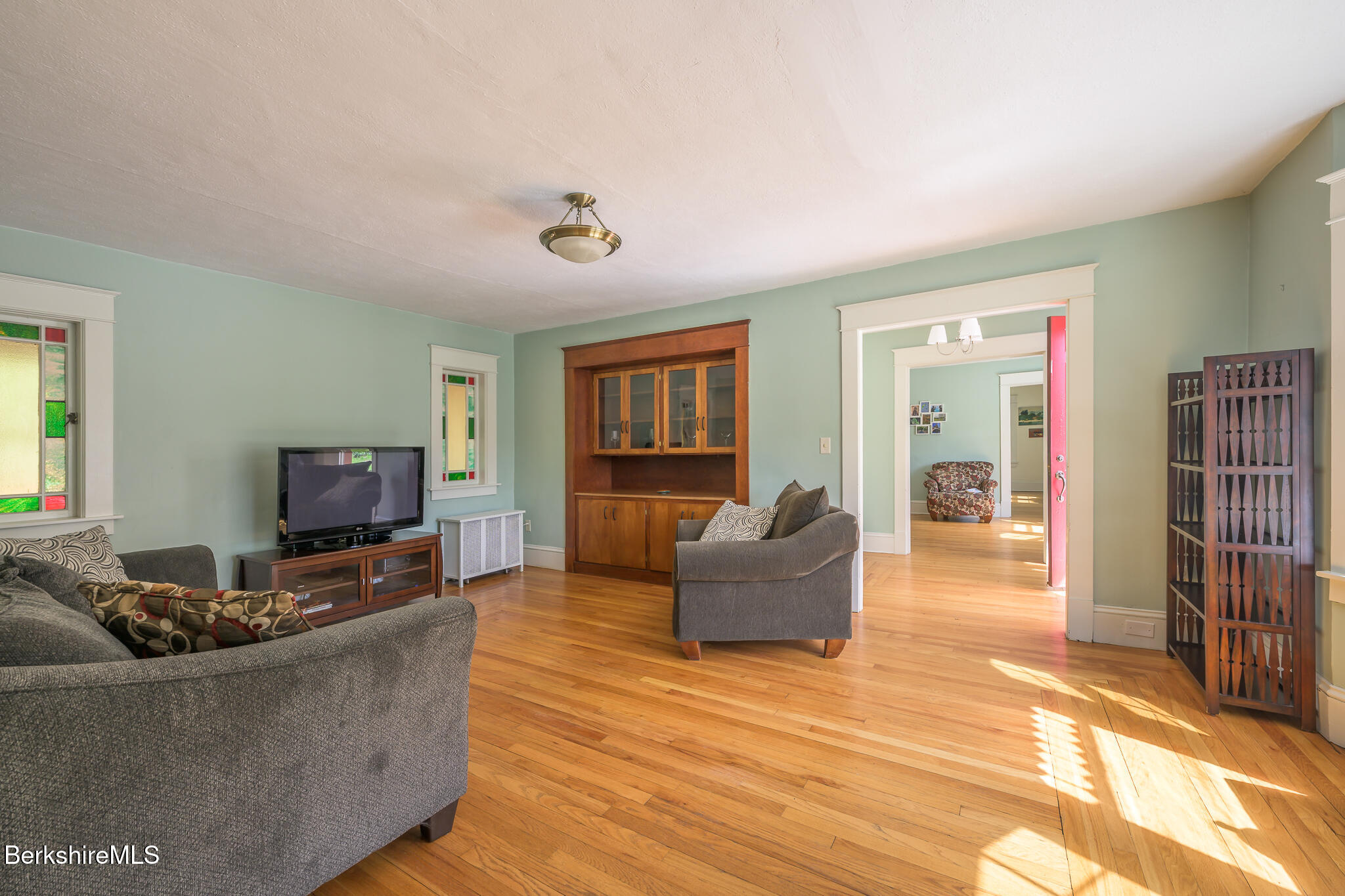 12 Riverfront Street Chester, MA 01011 - Photo 13 of 36 a living room with furniture and a flat screen tv
