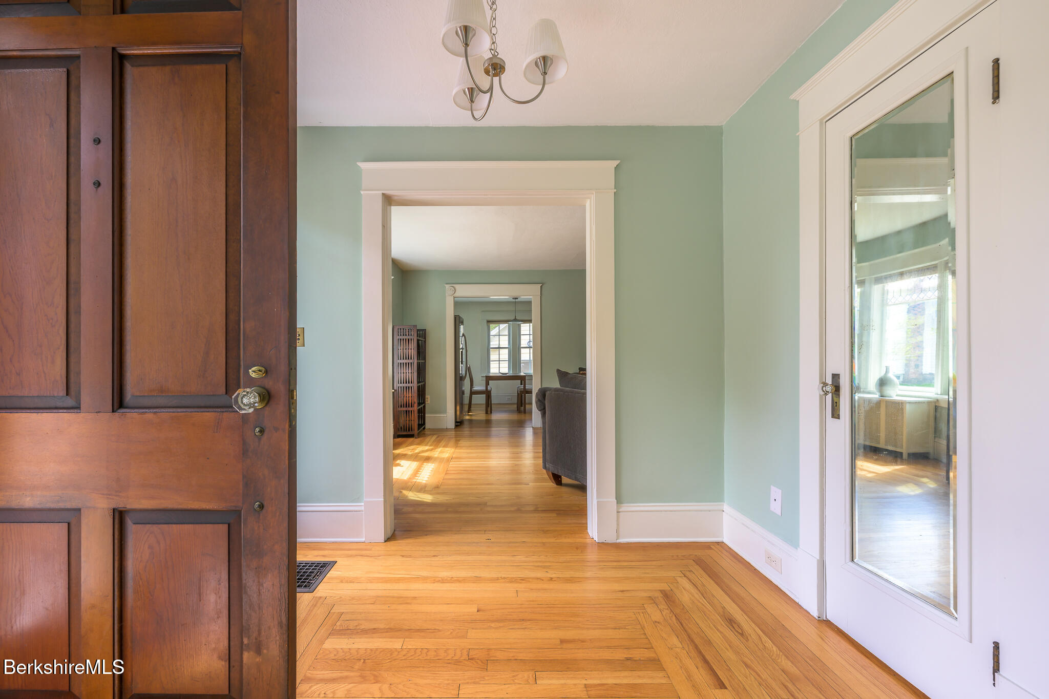 12 Riverfront Street Chester, MA 01011 - Photo 18 of 36 a view of a hallway with wooden floor and a livingroom