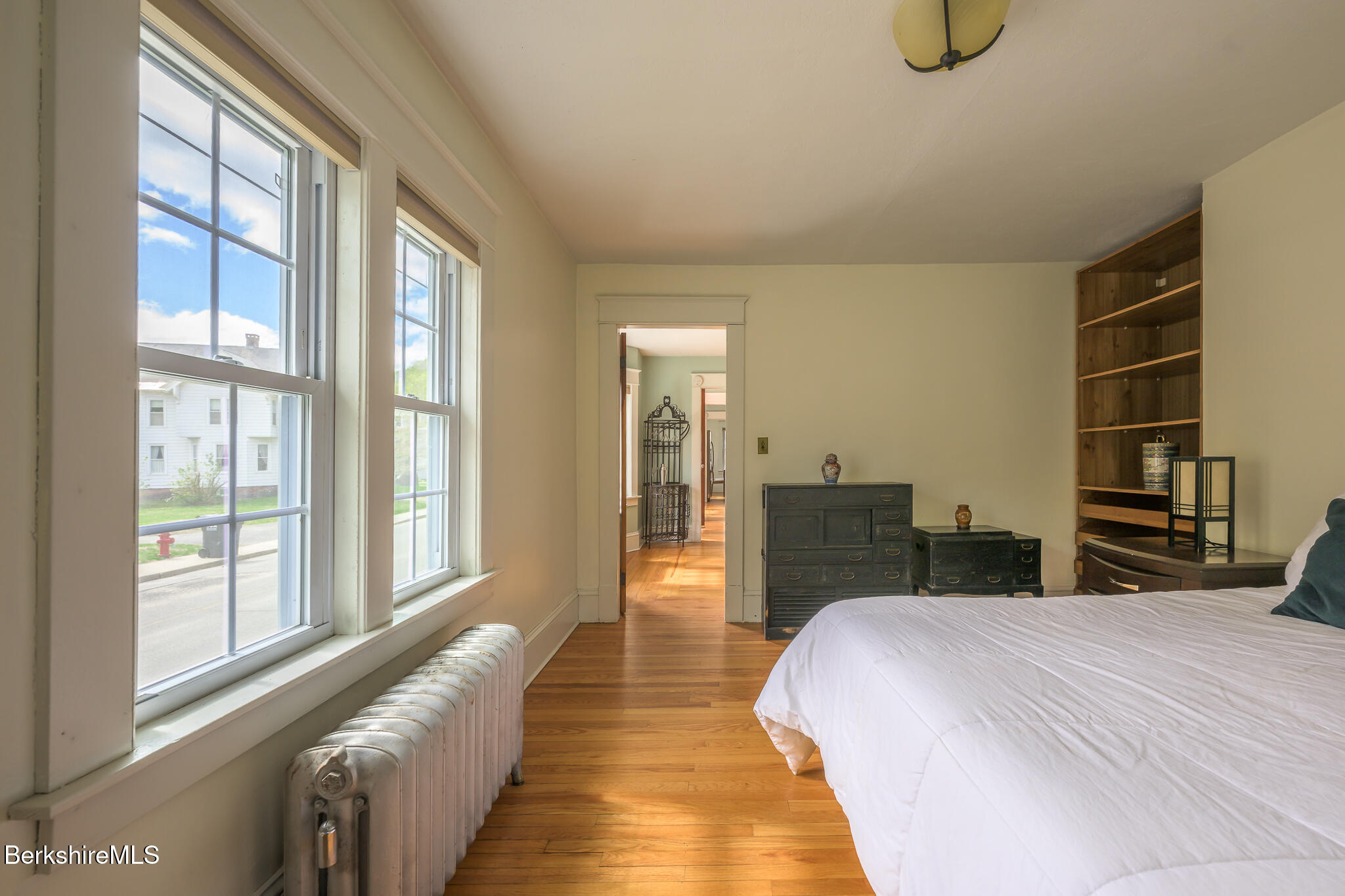 12 Riverfront Street Chester, MA 01011 - Photo 21 of 36 a bedroom with a bed and a large window with outer view