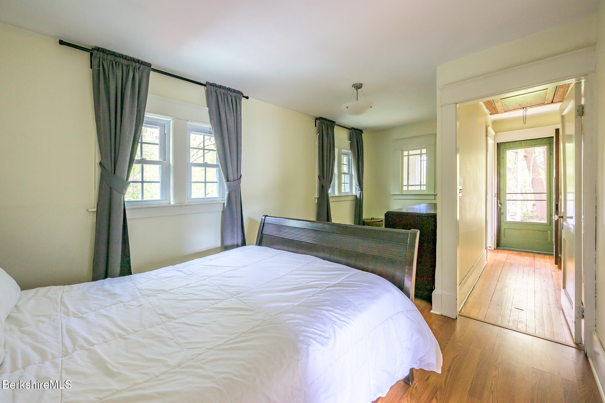 12 Riverfront Street Chester, MA 01011 - Photo 22 of 36 a bedroom with a bed and a large window