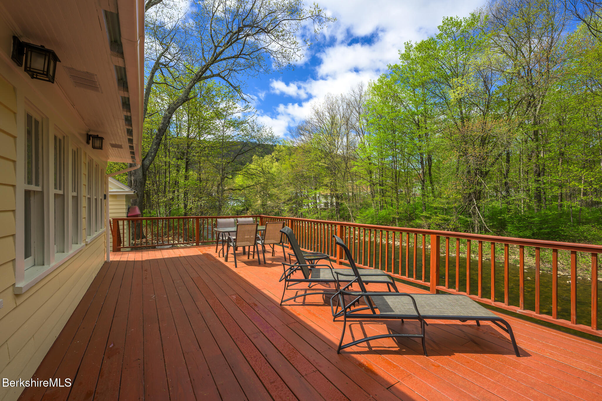 12 Riverfront Street Chester, MA 01011 - Photo 28 of 36 a balcony with wooden floor and outdoor space