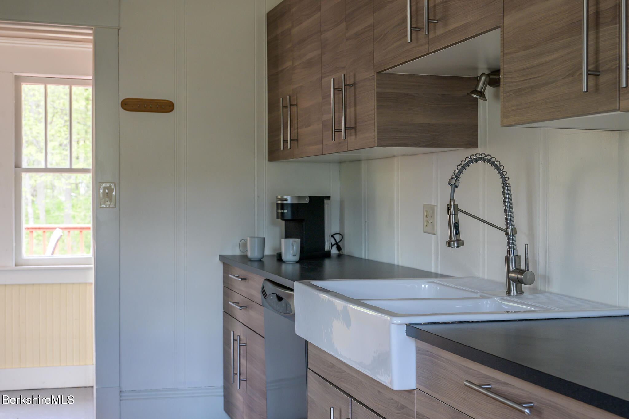 12 Riverfront Street Chester, MA 01011 - Photo 10 of 36 a kitchen with a sink and cabinets