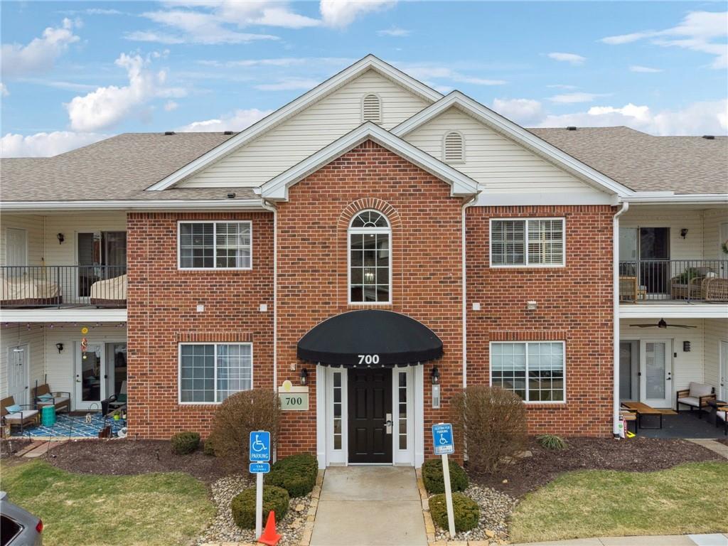 700 Hidden Ridge Court, Unit 302 South Park, PA 15129 - Photo 1 of 27 a front view of a house with garden