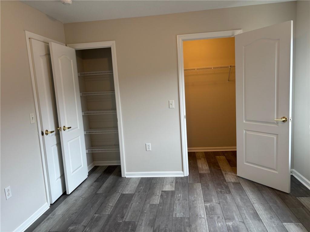 700 Hidden Ridge Court, Unit 302 South Park, PA 15129 - Photo 18 of 27 an empty room with wooden floor and closet