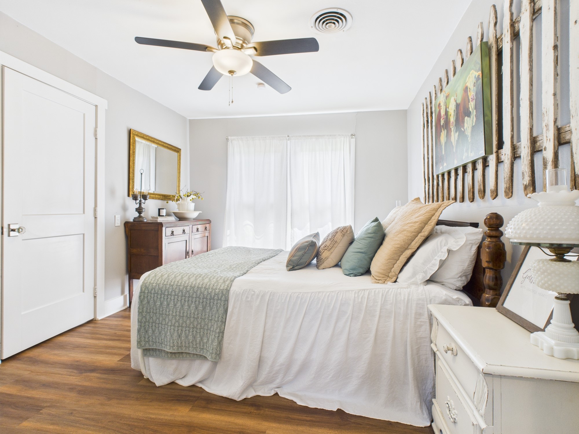 100 Hill Ranch Lane New Waverly, TX 77358 - Photo 13 of 23 a bedroom with a large bed and a chandelier