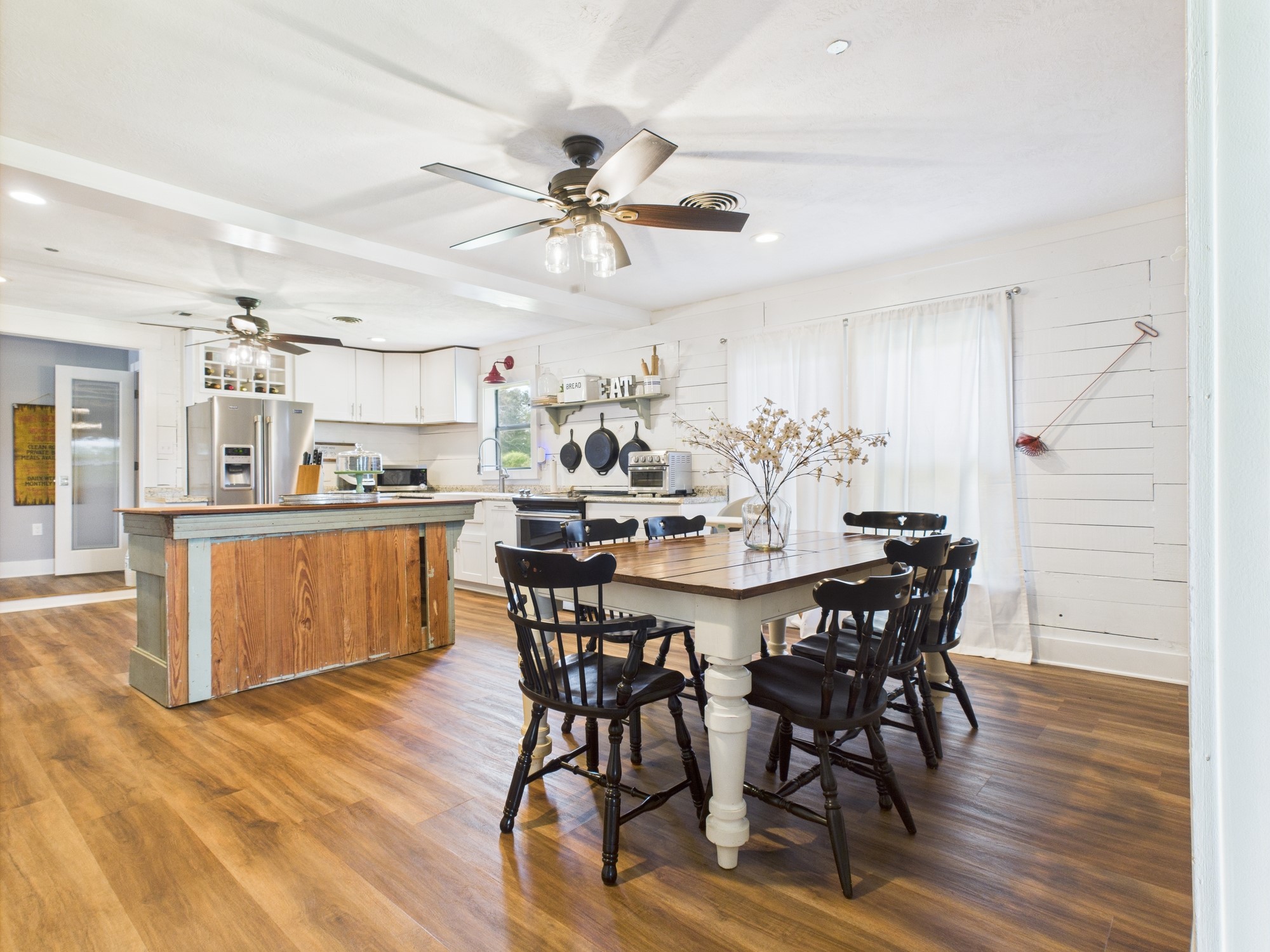 100 Hill Ranch Lane New Waverly, TX 77358 - Photo 16 of 23 a view of a dining room with furniture and wooden floor
