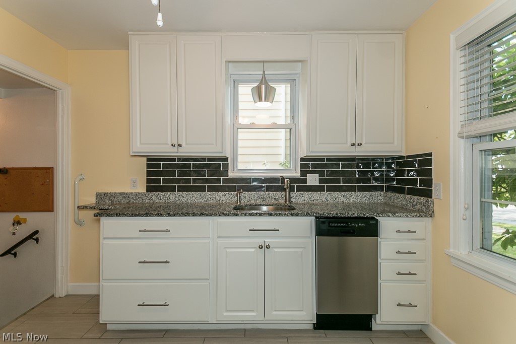 1005 Argonne Road Cleveland, OH 44121 - Photo 3 of 31 This kitchen is a dream! Remodeled in 2016 with new cabinets, granite counters, tile backsplash and flooring. All appliances stay.