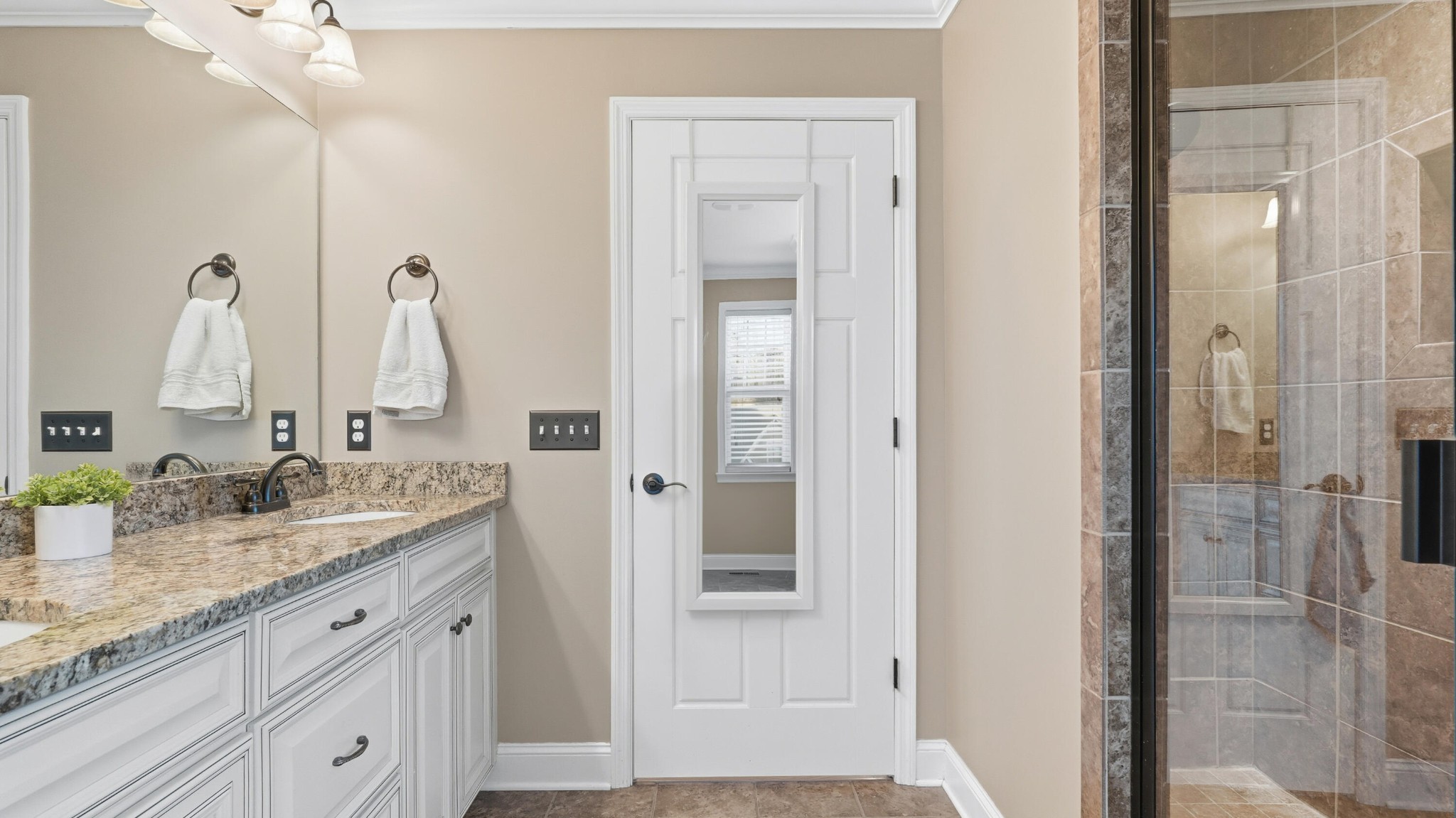 274 Live Oak Road Ringgold, GA 30736 - Photo 11 of 28 a bathroom with a granite countertop sink and a mirror