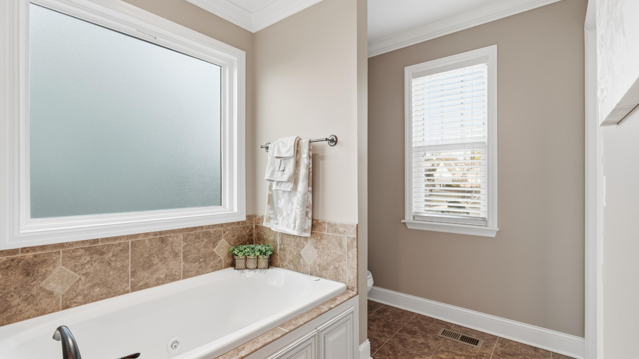 274 Live Oak Road Ringgold, GA 30736 - Photo 13 of 28 a bathroom with a bathtub and a window