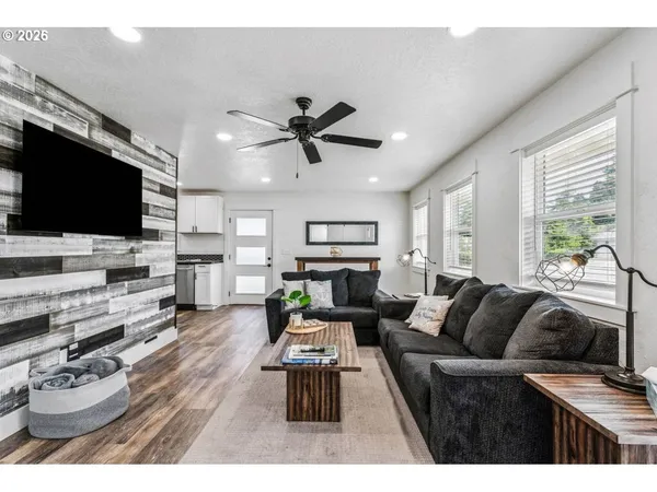 a living room with furniture and a flat screen tv