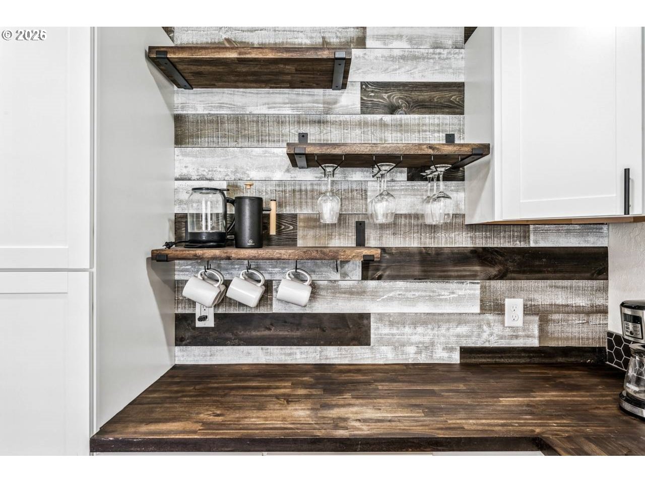 1184 2nd Street Florence, OR 97439 - Photo 16 of 44 a kitchen with stainless steel appliances granite countertop a stove and a microwave