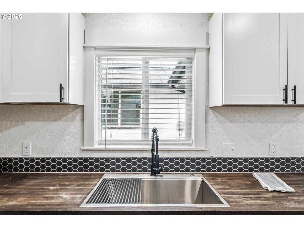 1184 2nd Street Florence, OR 97439 - Photo 18 of 44 a view of kitchen with granite countertop cabinets