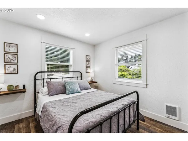 a room with a walk in closet and wooden floor