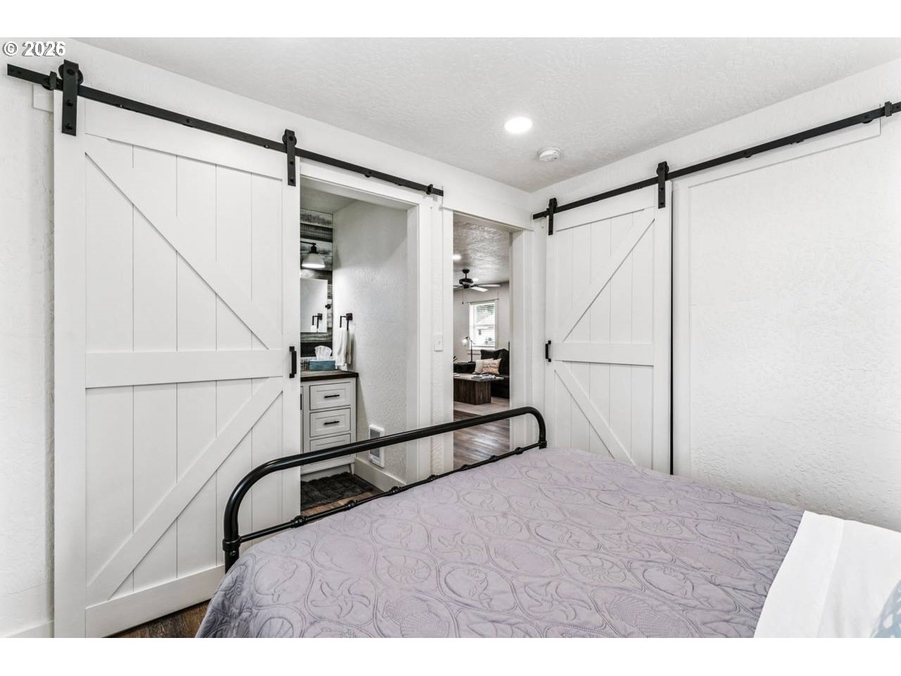 1184 2nd Street Florence, OR 97439 - Photo 24 of 44 a room with a walk in closet and wooden floor