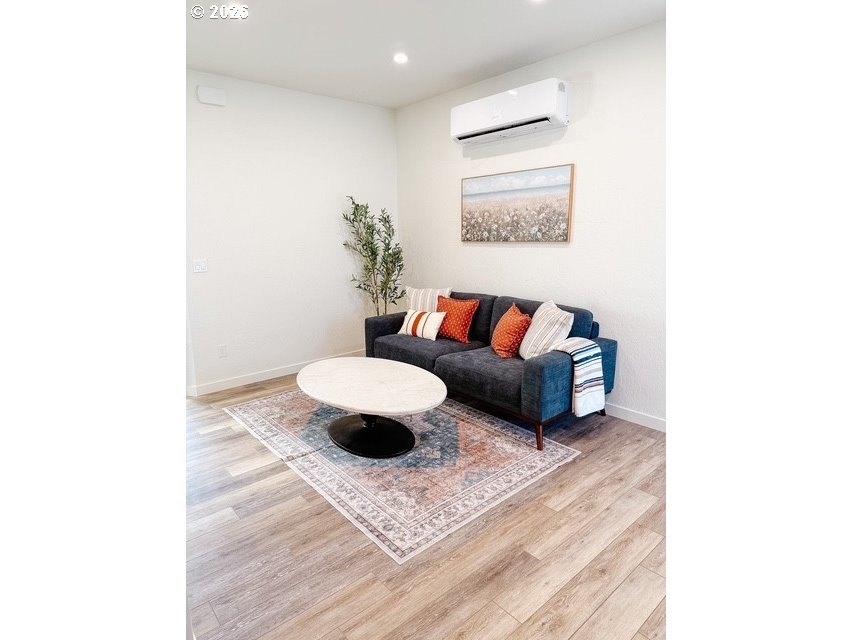 1184 2nd Street Florence, OR 97439 - Photo 35 of 44 a living room with furniture and a rug