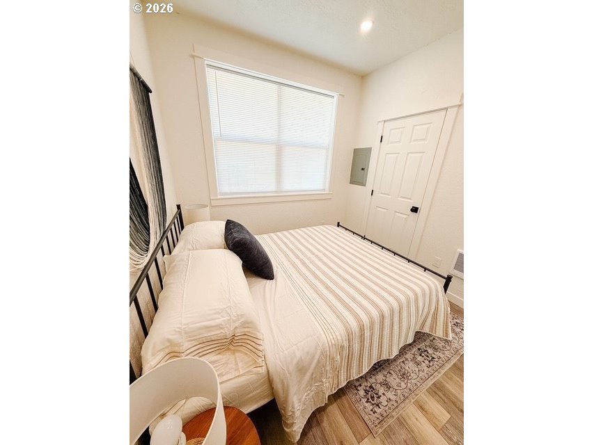 1184 2nd Street Florence, OR 97439 - Photo 43 of 44 a bedroom with a bed and a window