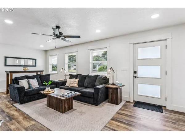 a living room with furniture and a large window