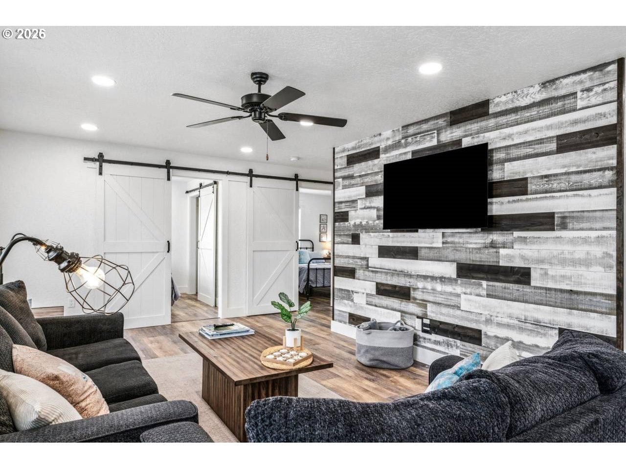 1184 2nd Street Florence, OR 97439 - Photo 10 of 44 a living room with furniture and a flat screen tv