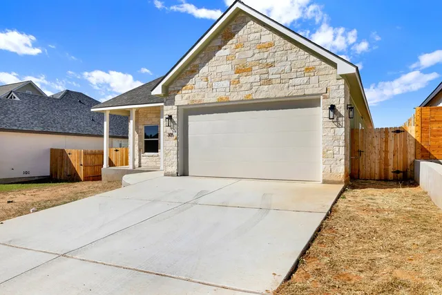 a view of white house with a wooden floor