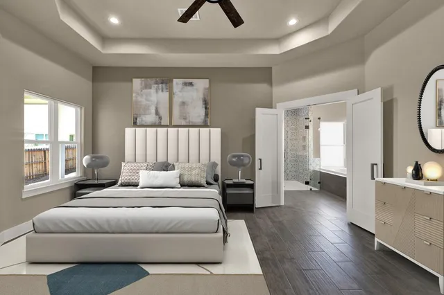 a spacious bedroom with a bed a couch and a large window